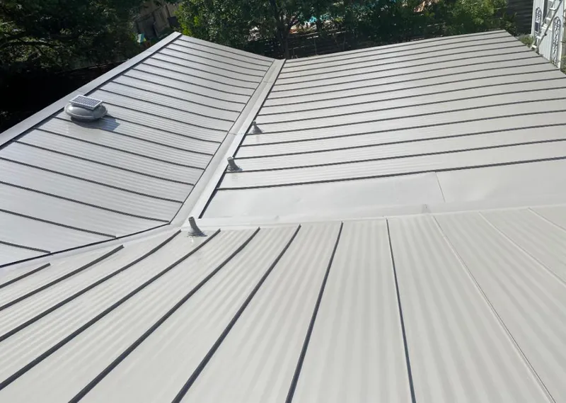 Solar attic fan installed on a metal roof for Roof Ventilation in Hinesville